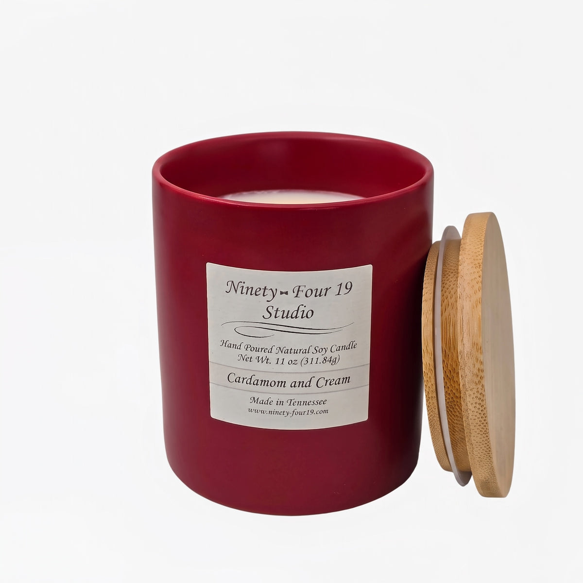scented natural soy wax candle in a ruby ceramic container
