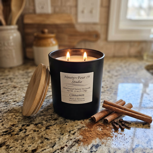 natural soy wax candle in a black ceraminc container