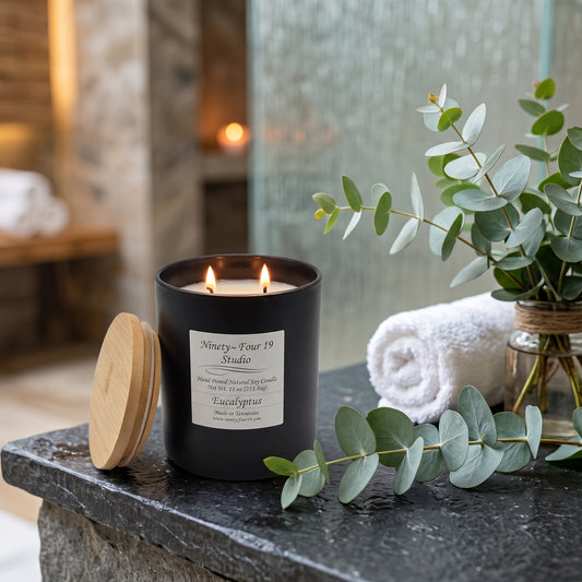 natural soy wax candle in a black ceramic container