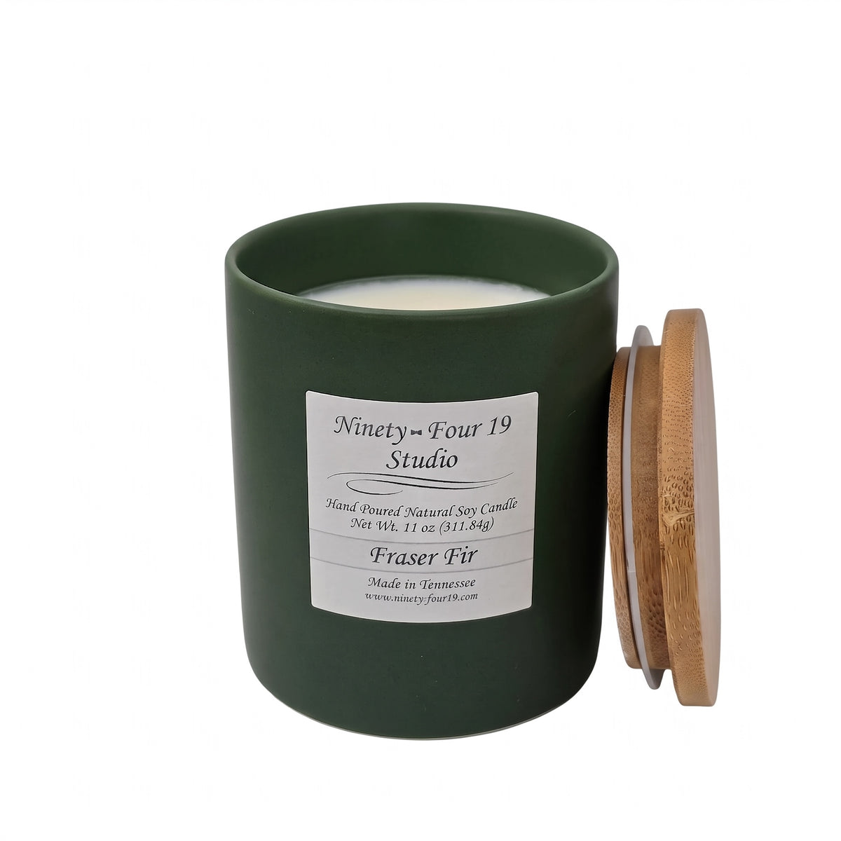 scented natural soy wax candle in evergreen ceramic container