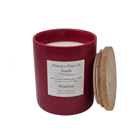scented natural soy wax candle in a ruby ceramic container