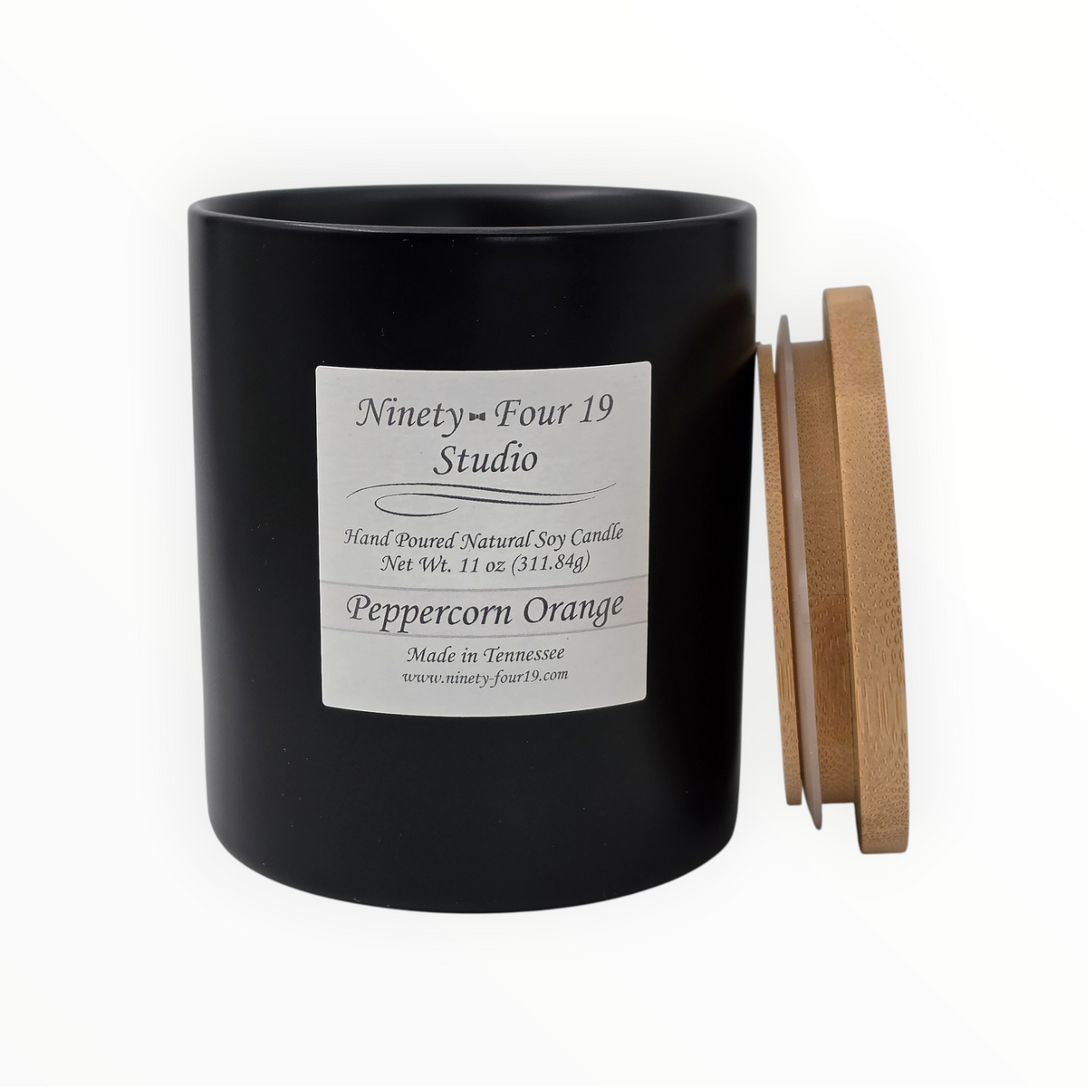 Natural soy wax candle in a black ceramic container