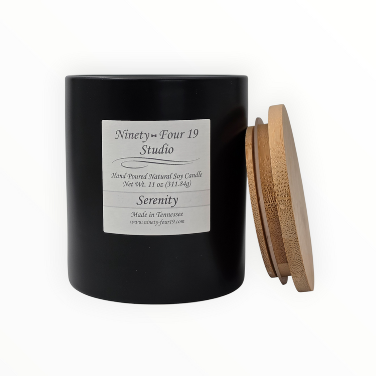natural soy wax candle in a black ceramic container