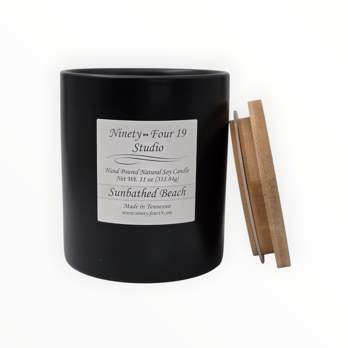 natural soy wax candle in a black ceramic container