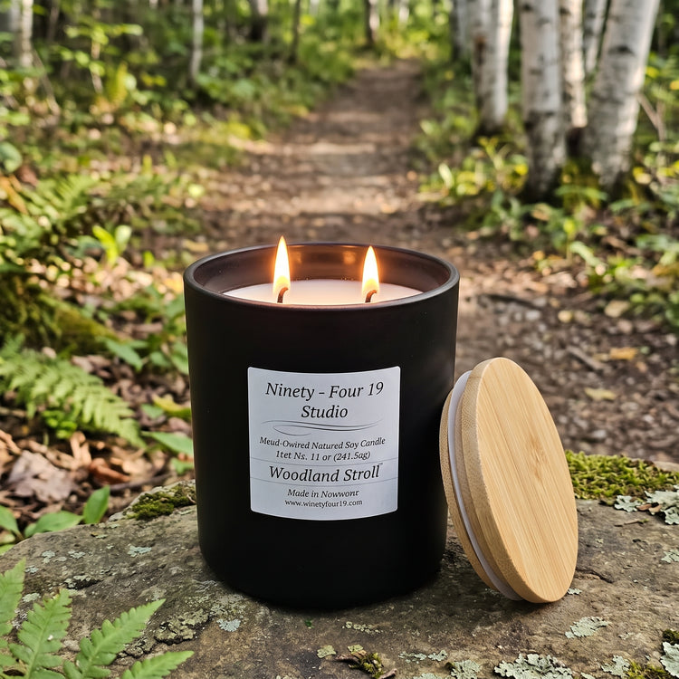 scented natural soy wax candle in a black ceramic container